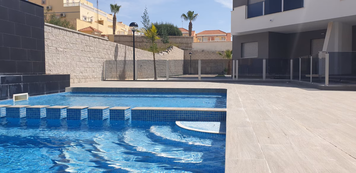Pool edge with steps and landscaped surroundings
