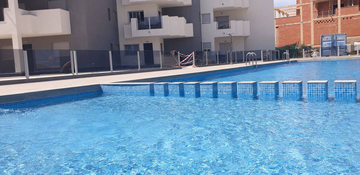 Communal pool with apartment balconies behind