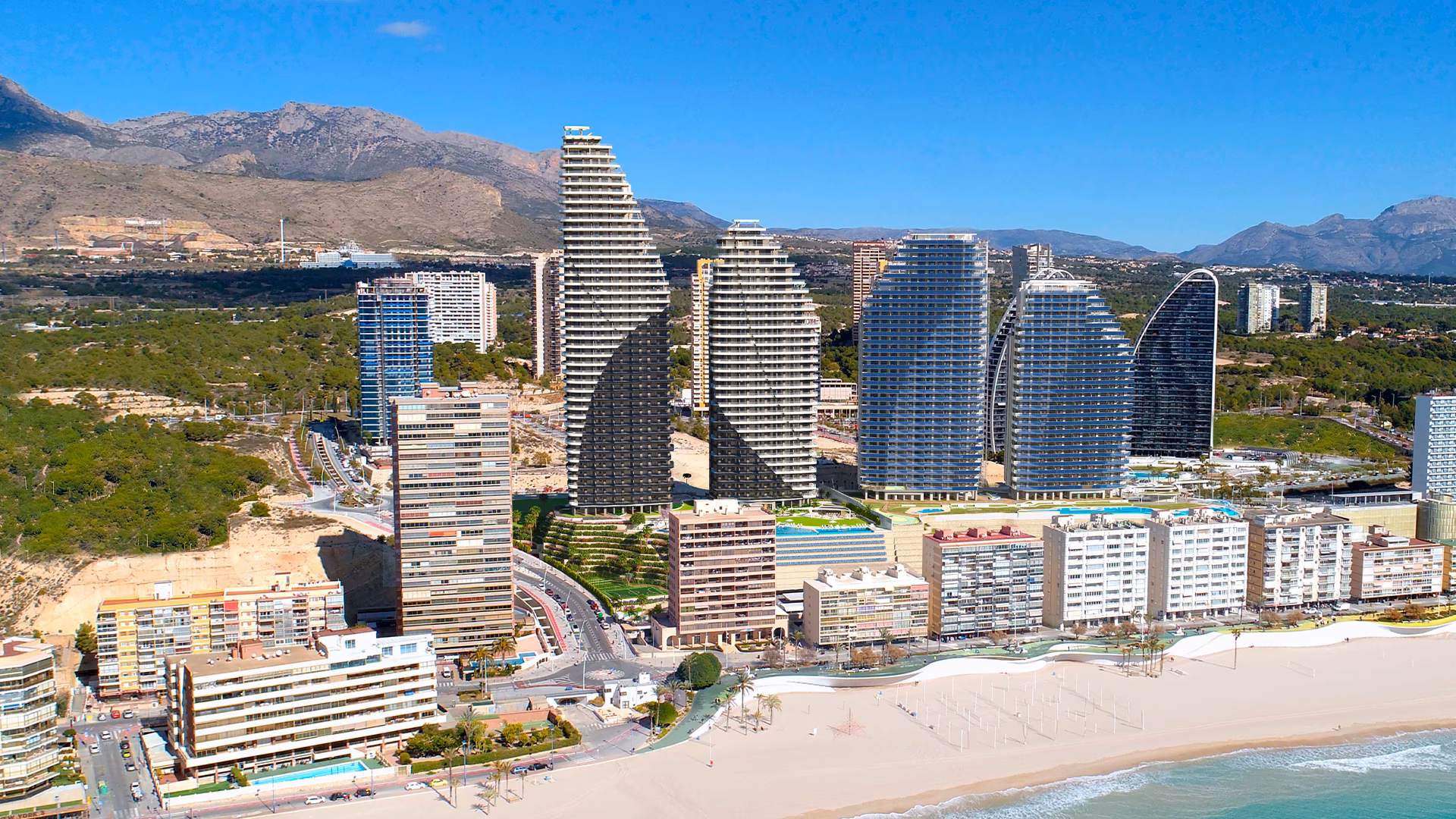 Aerial view of the Poniente seafront with the towers behind the beach