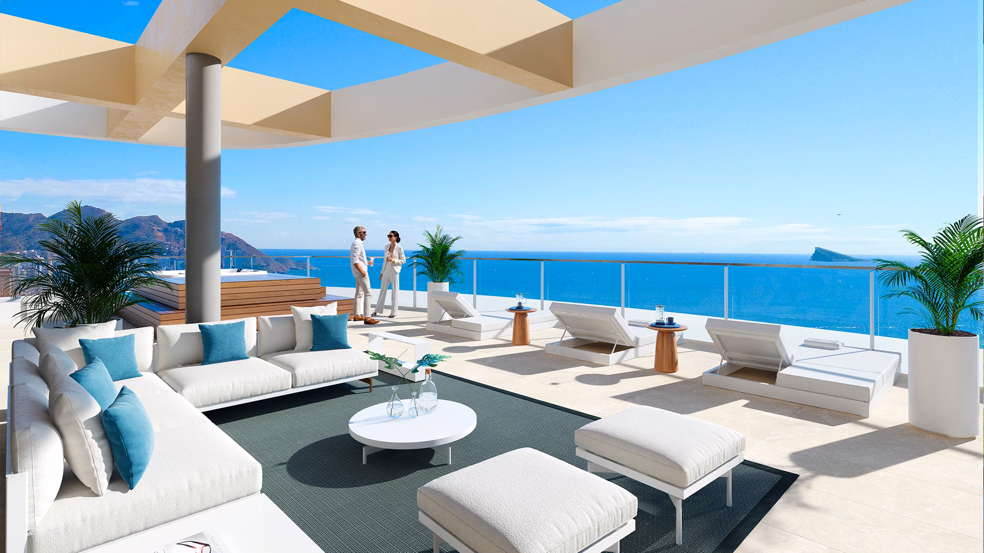 Roof terrace lounge with sofas, sun loungers and a sea view