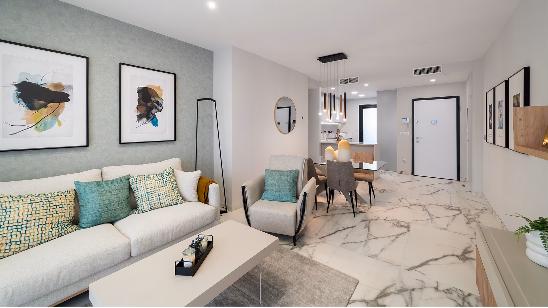 Living room with sofas and armchair by the entrance hall
