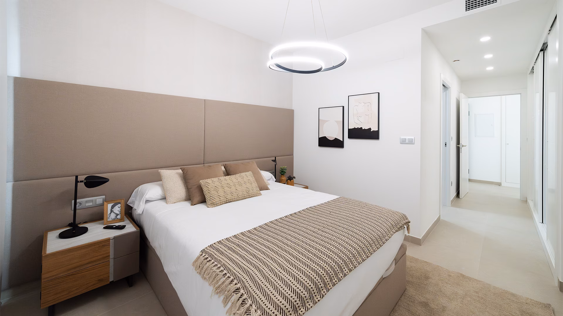 Bedroom with double bed and ring pendant light