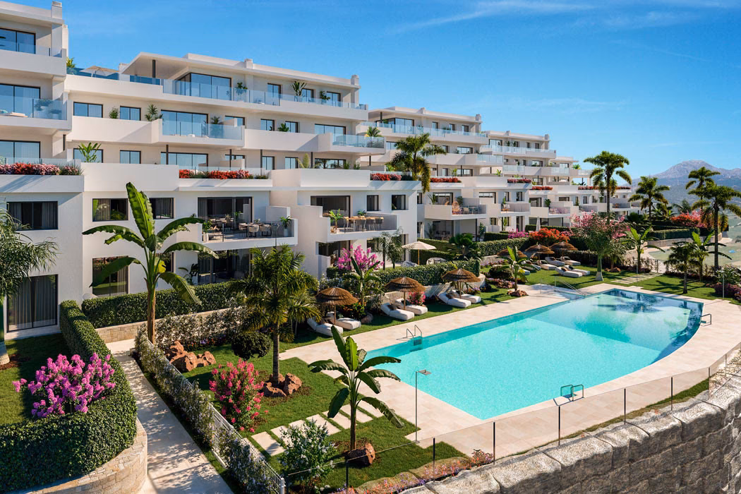 Terraced white blocks above the garden pool, mountains in the distance