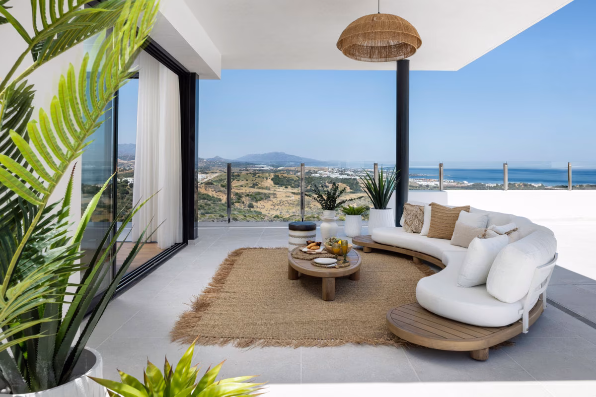 Terrace lounge with sea and mountain views