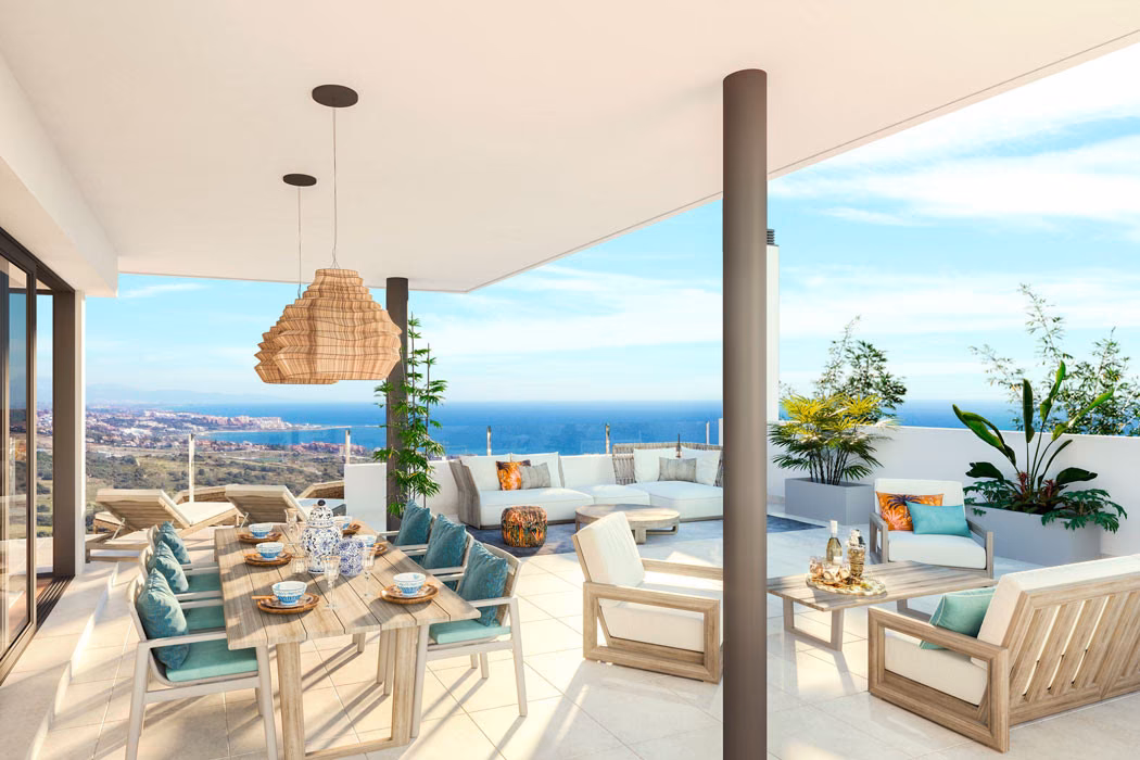 Covered terrace with dining table and sea view
