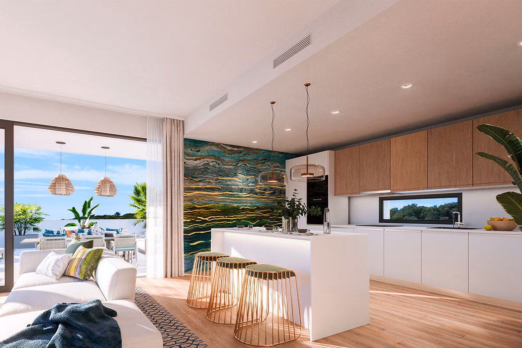 Open kitchen with island, bar stools and terrace beyond