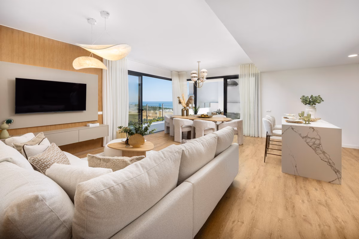 Sofa and dining table in a bright open-plan room
