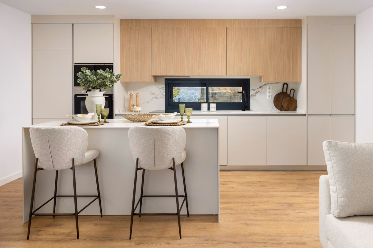 White kitchen with island and bar stools