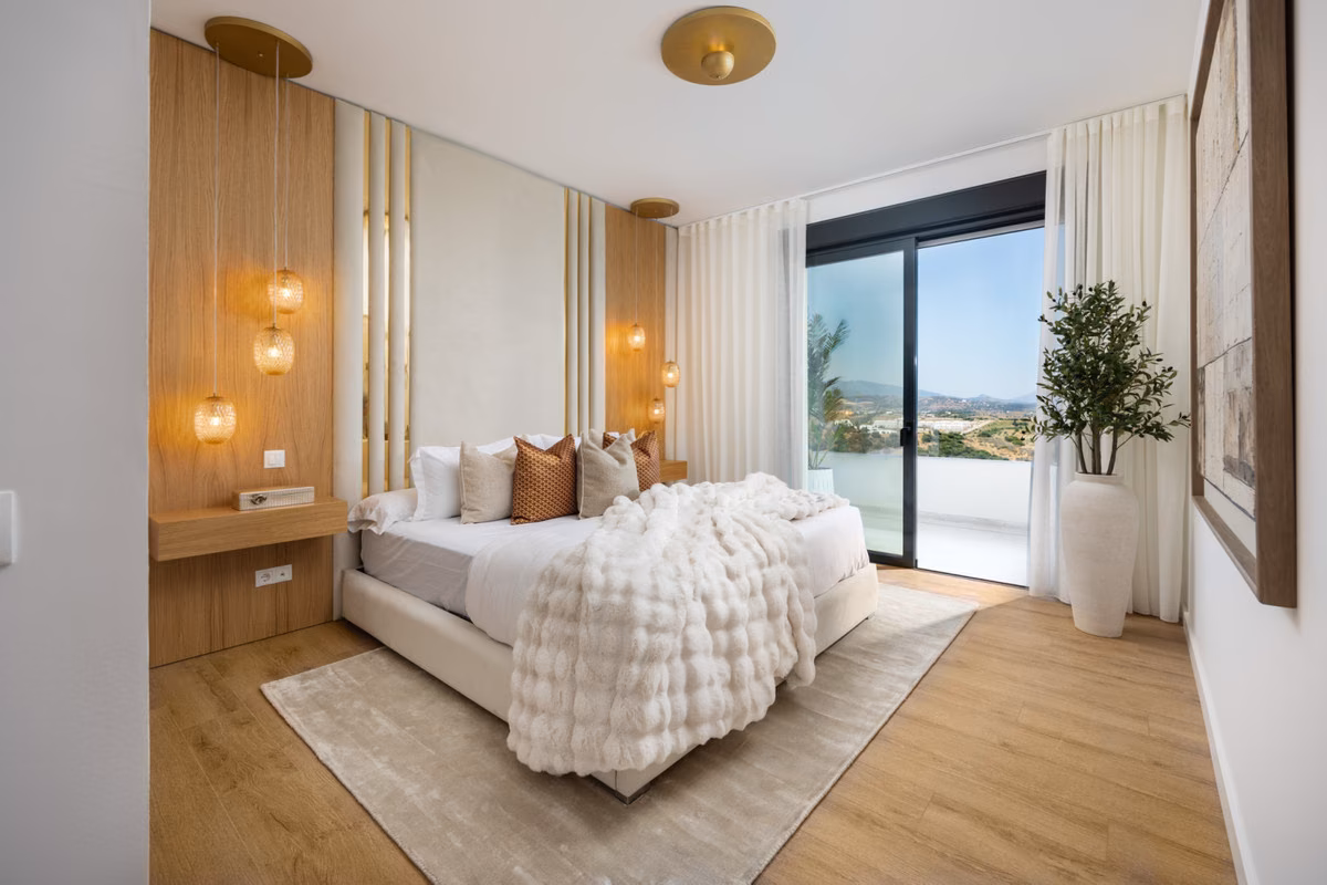 Bedroom with timber wall panel and sliding door to the terrace