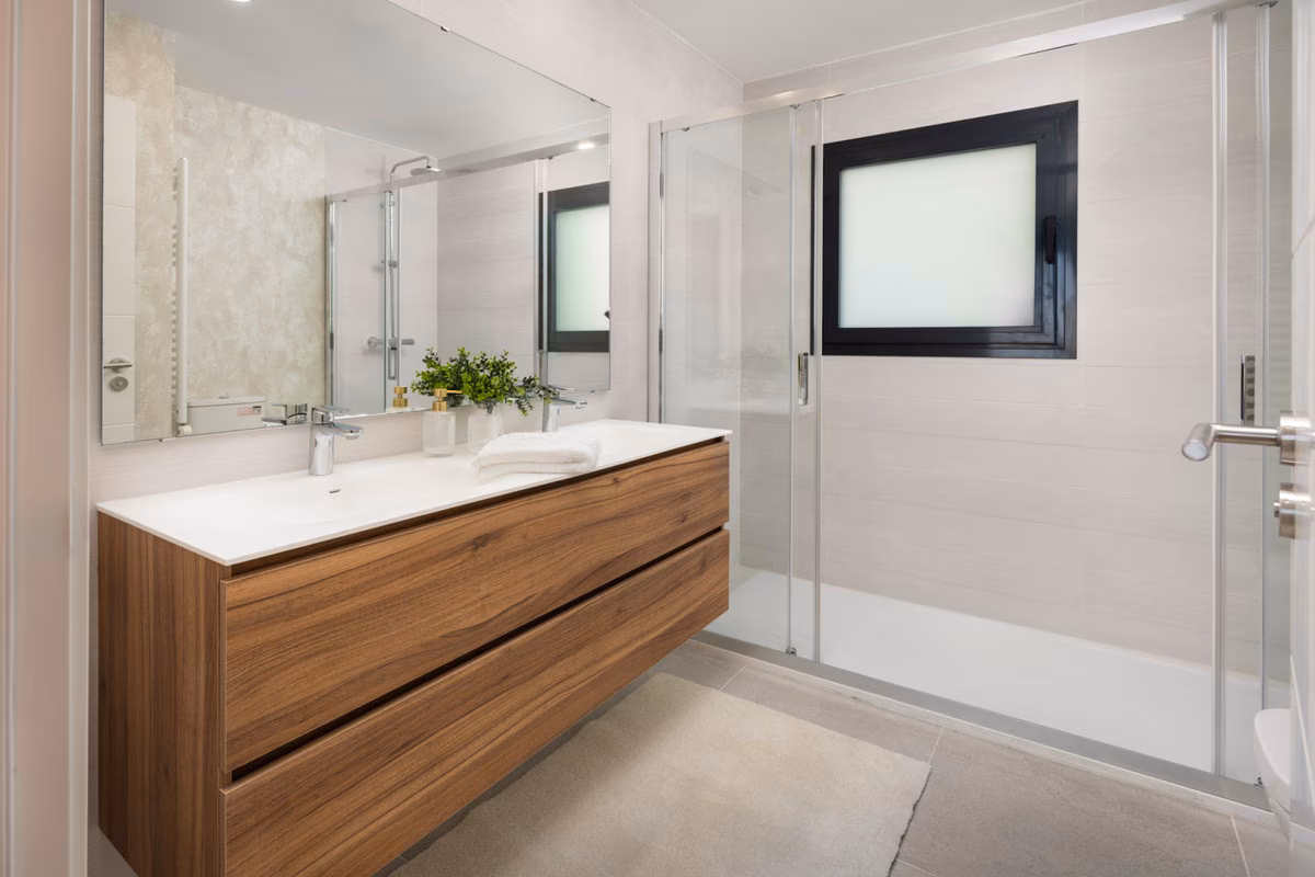 Bathroom with double vanity and glass shower