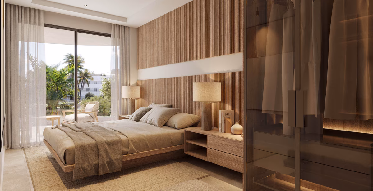 Living space opening to the terrace through floor-to-ceiling glass