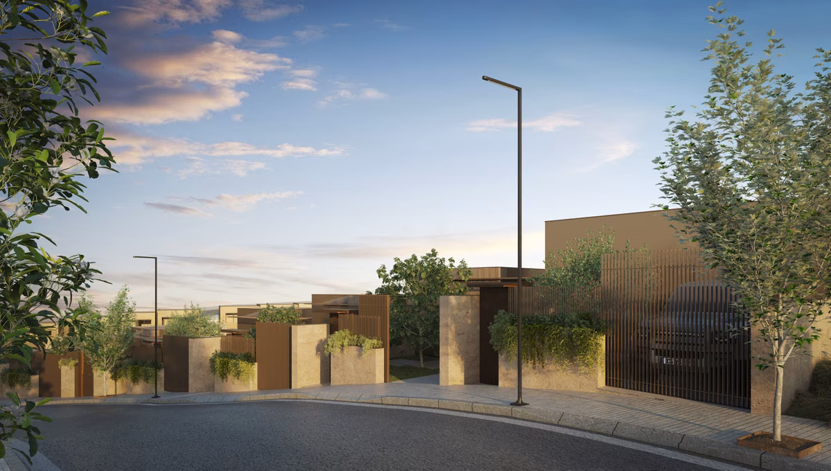 Entrance gates of The Valley townhouses at dusk