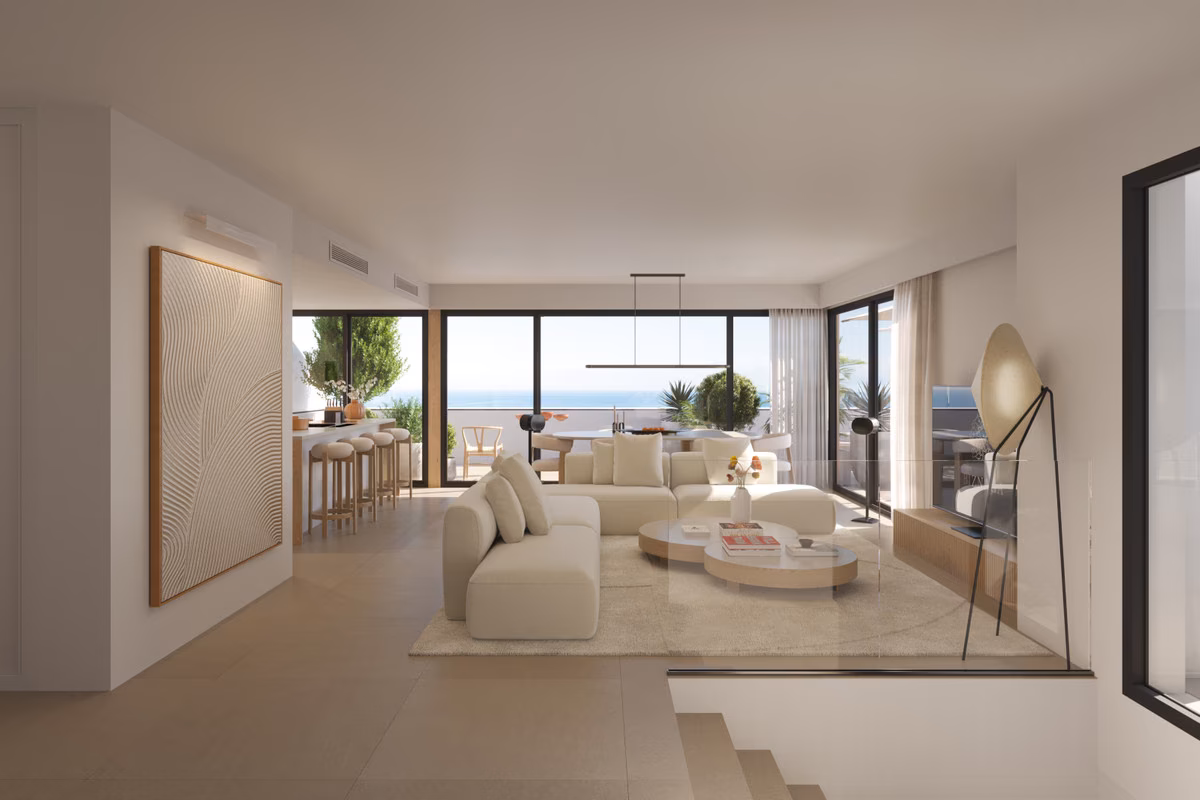 Open-plan living and dining room with sea-facing windows at Torre Biznaga