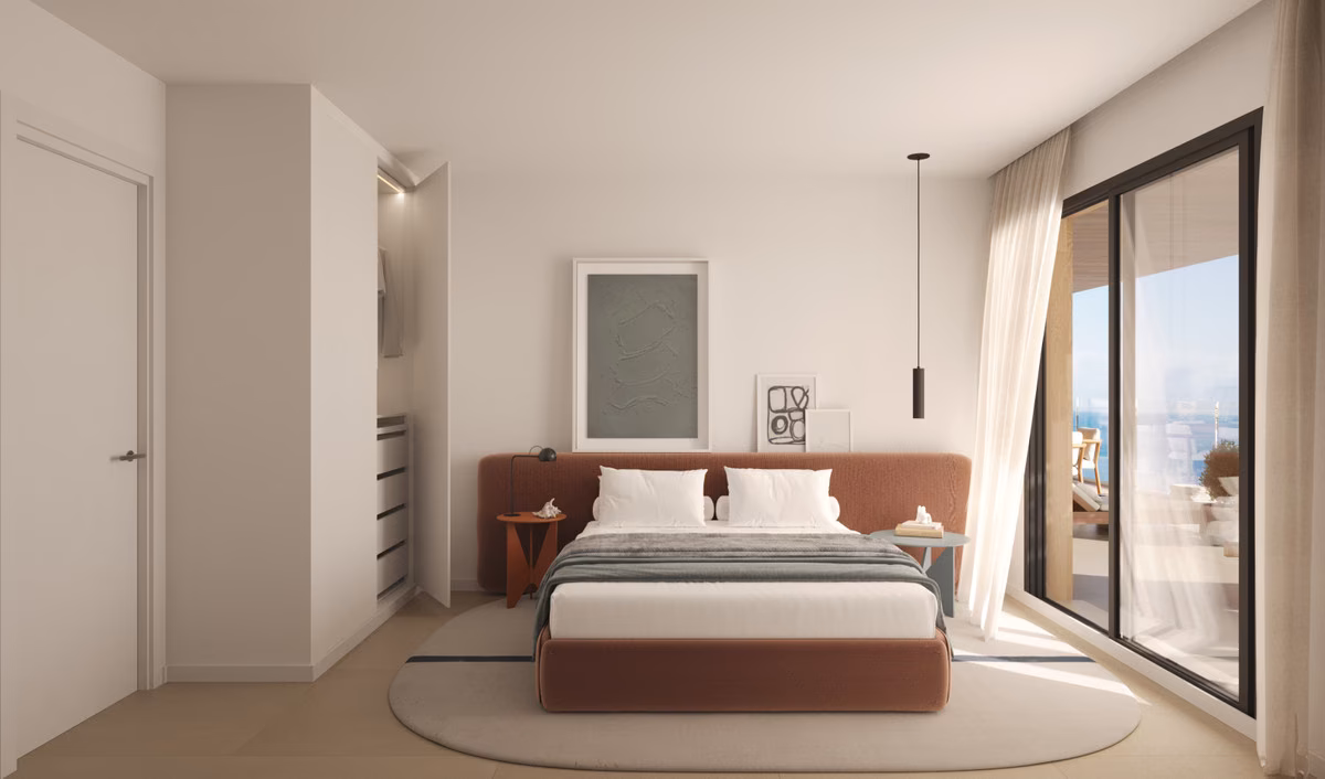 Bedroom with terrace door in a Torre Biznaga apartment