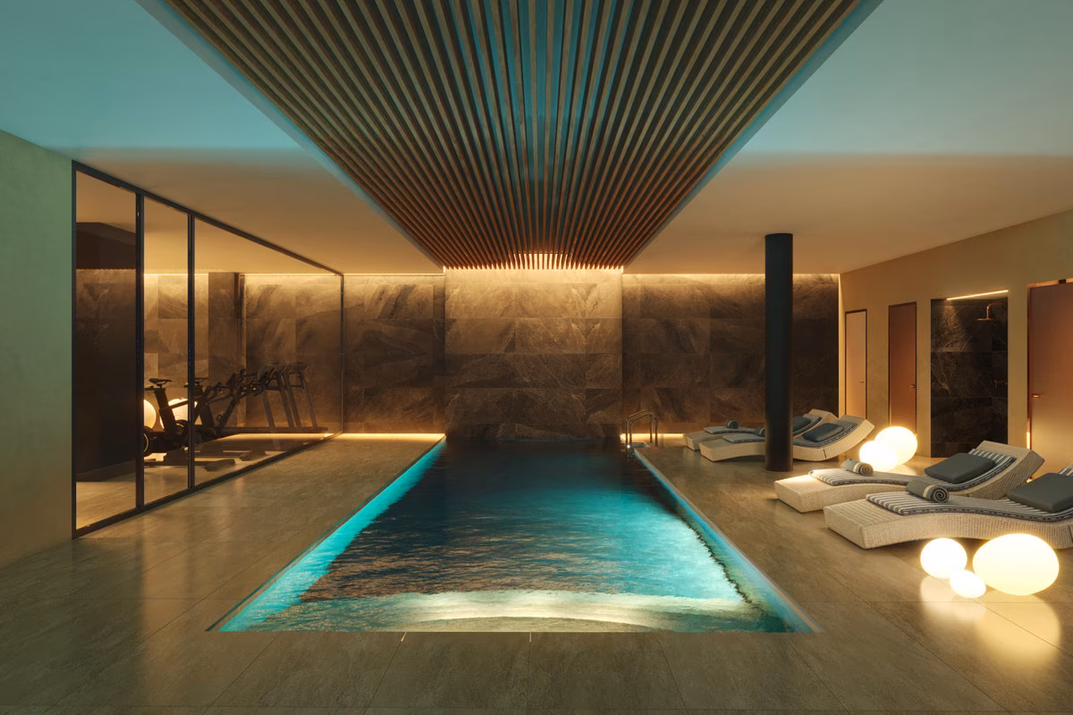 Indoor pool with wooden-slat ceiling and loungers at Torre Biznaga