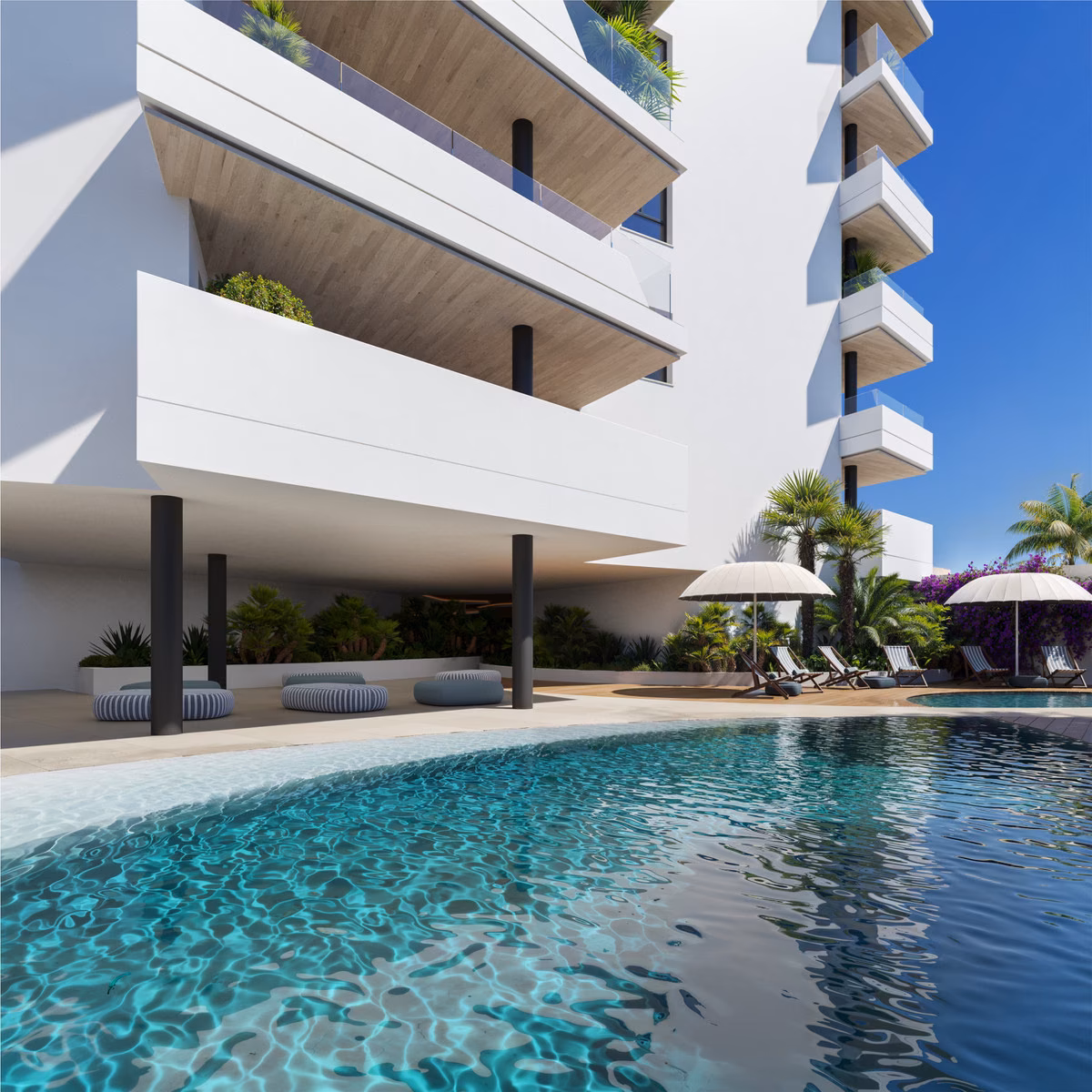 Outdoor pool at the foot of the Torre Biznaga tower