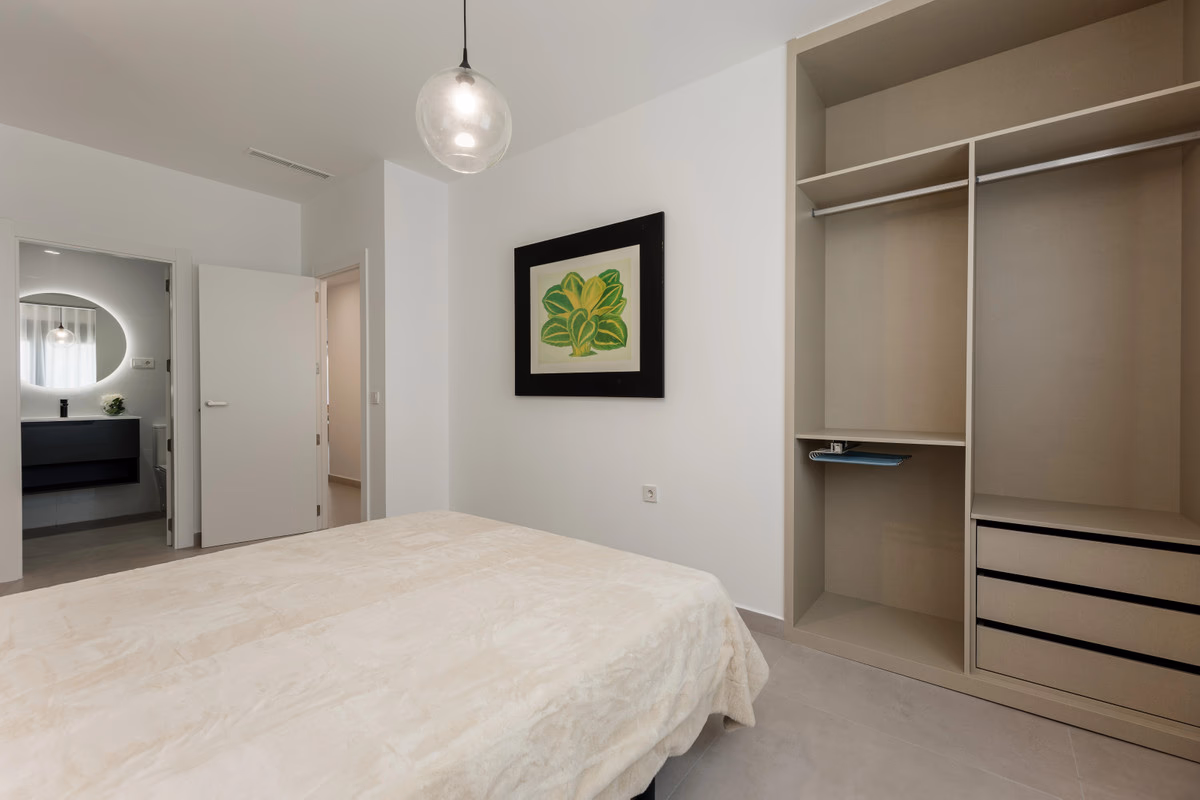 Bedroom with a fitted walk-in wardrobe at Moratella
