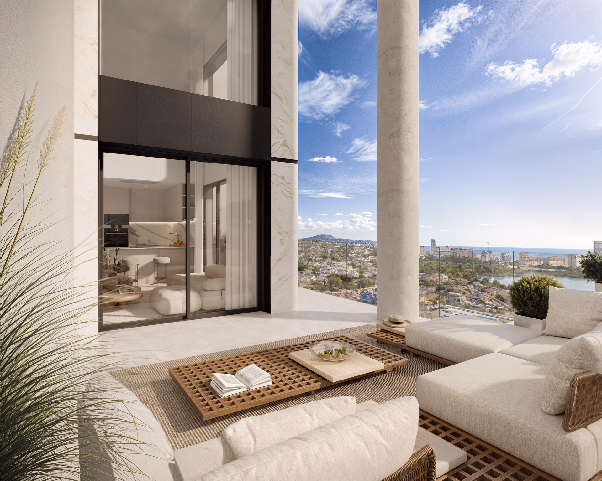 Terrasse meublée avec canapé d’extérieur et vue mer