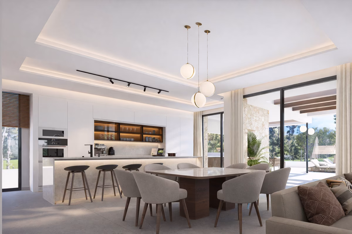 Cocina abierta con isla y mesa de comedor