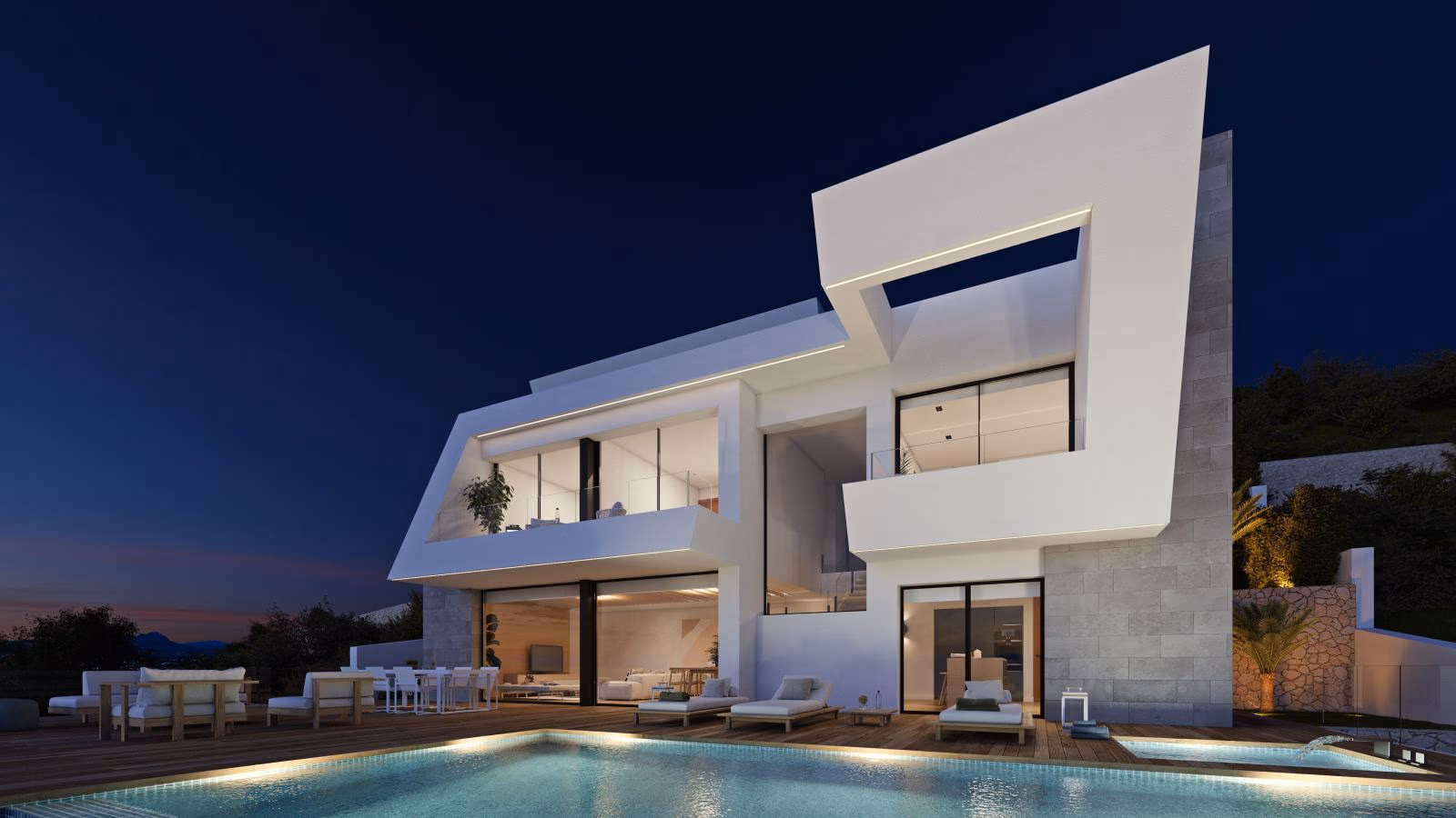 The villa and pool at dusk with a sunset sky