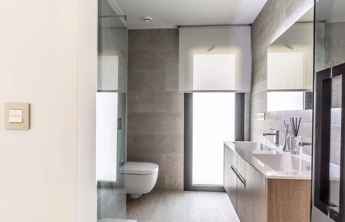 Bathroom with twin basins and a walk-in shower