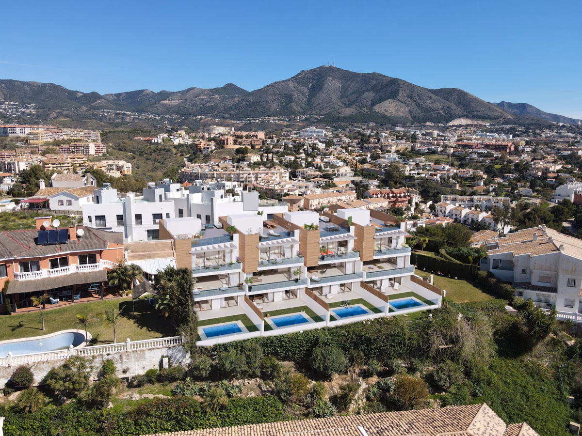 Street view of the gated Vista Linda villas with parking, Fuengirola