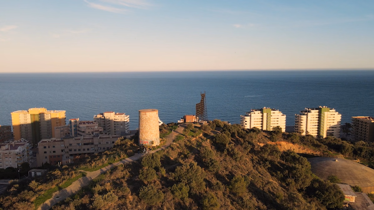 Aerial view of Torreblanca hill and Fuengirola coast at dusk, Vista Linda
