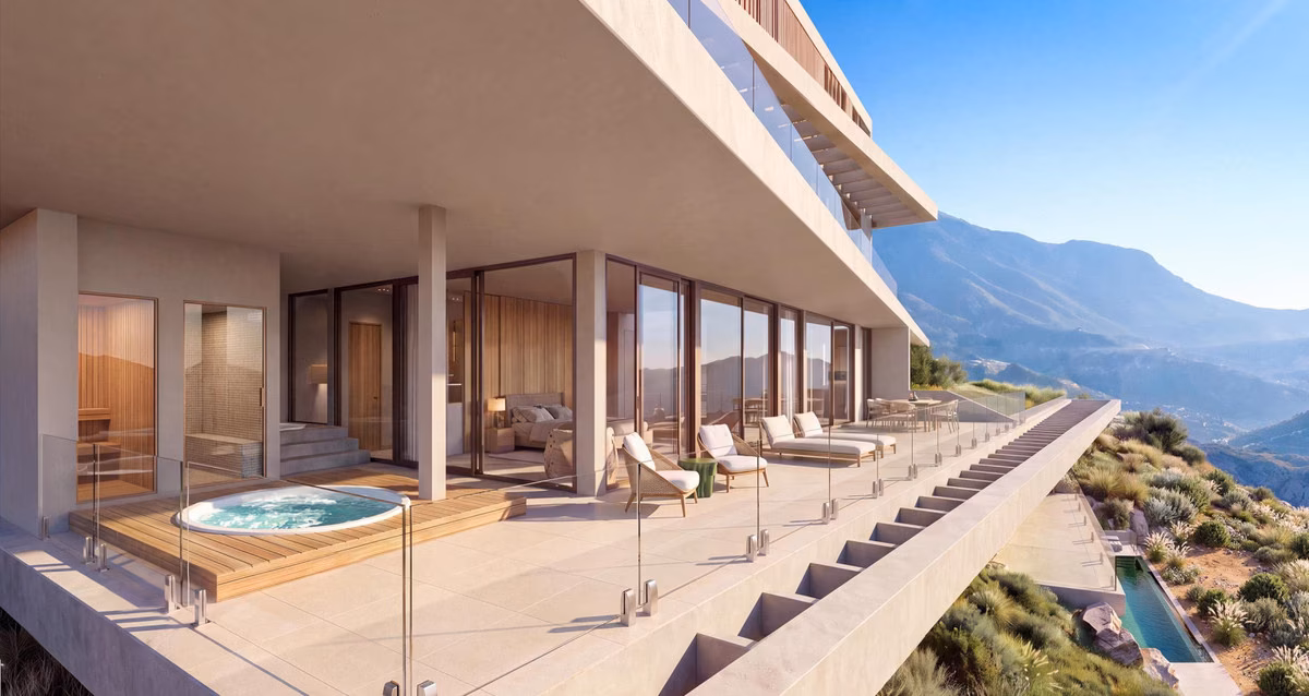Boventerras met jacuzzi, ligbedden en glazen balustrade