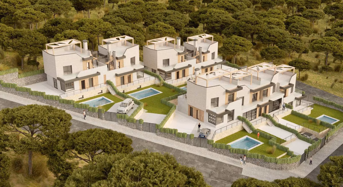 Aerial view of detached and semi-detached villas with private pools among pine trees