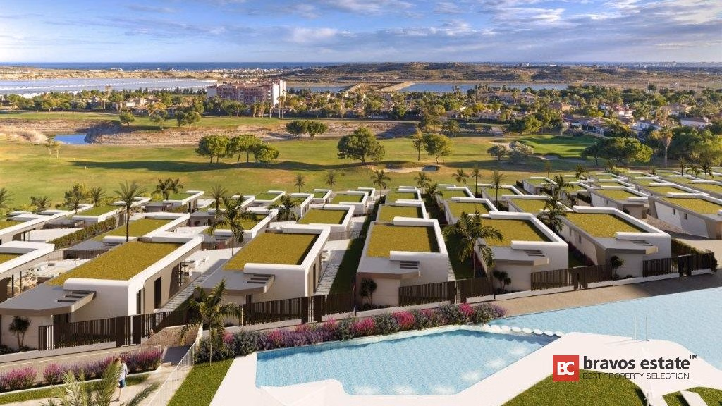 CGI render of Bonalba Green Villas showing an aerial view of white modern villas with green rooftops, a communal pool, and Bonalba Golf Resort's fairways stretching toward the coast.