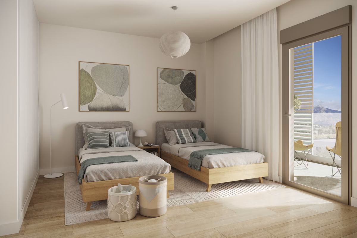 Twin bedroom with a door to the balcony